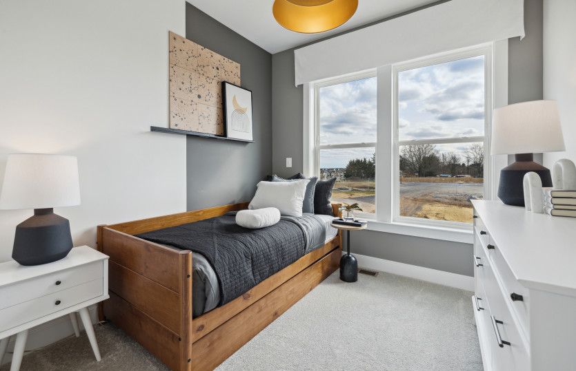 Spacious Secondary Bedroom with Plush Carpeting