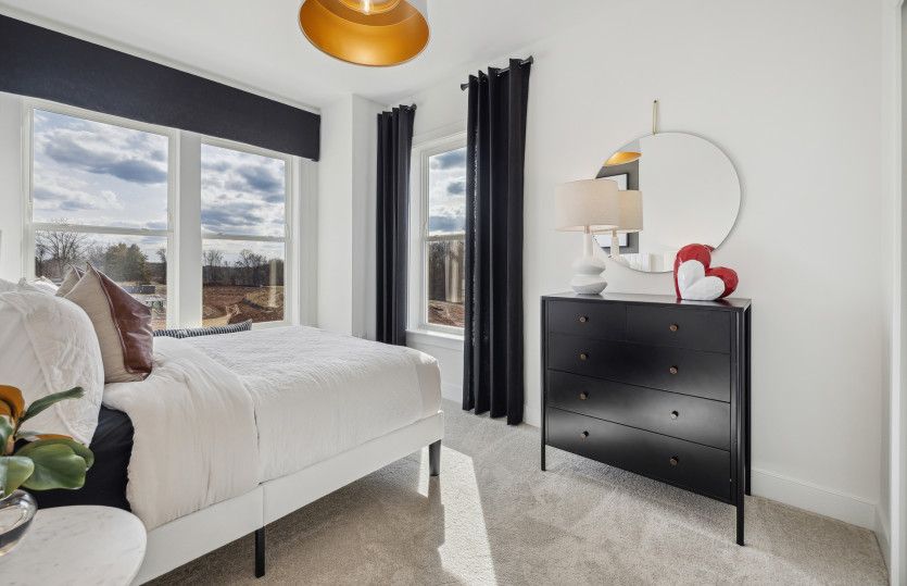 Spacious Secondary Bedroom with Plush Carpeting