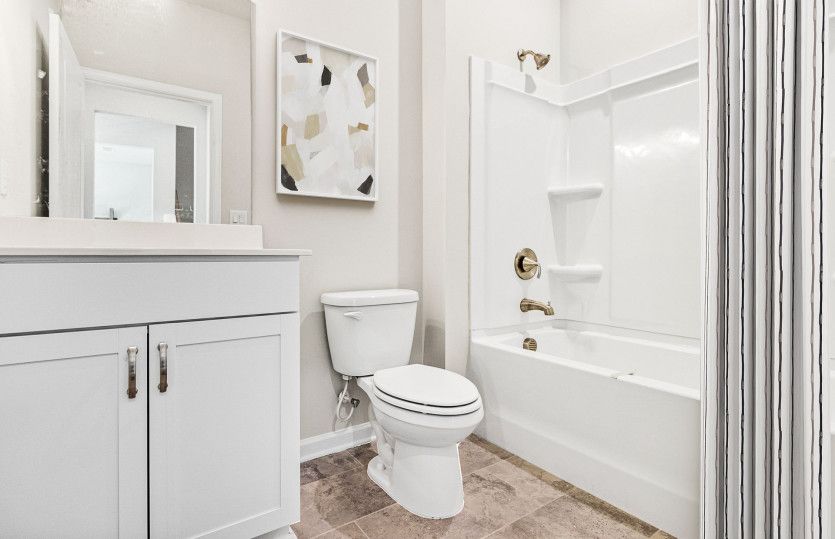 Secondary Bathroom with a soaking tub.