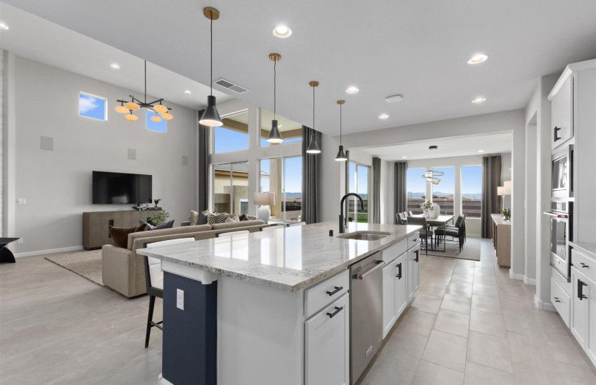 Spacious kitchen with white colored cabinets and premium KitchenAid® appliances.
