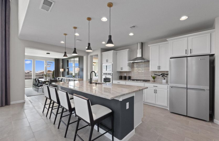 Stunning granite countertops and tile back splash.