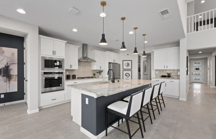 Breakfast bar allows for seating at the kitchen island.
