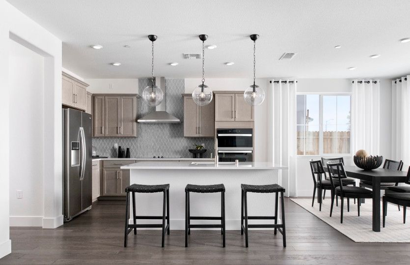 Open kitchen leading into inviting dining area