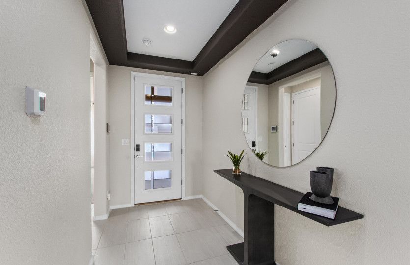 The Tifton Walk home greets you with a foyer and modern front door.