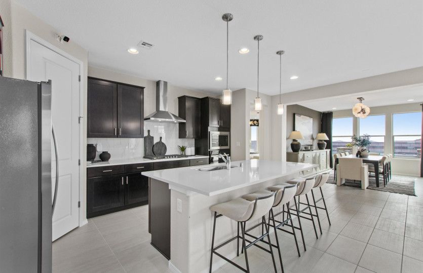 Use the kitchen island as a casual spot for busy morning breakfasts or to host your cocktail party a