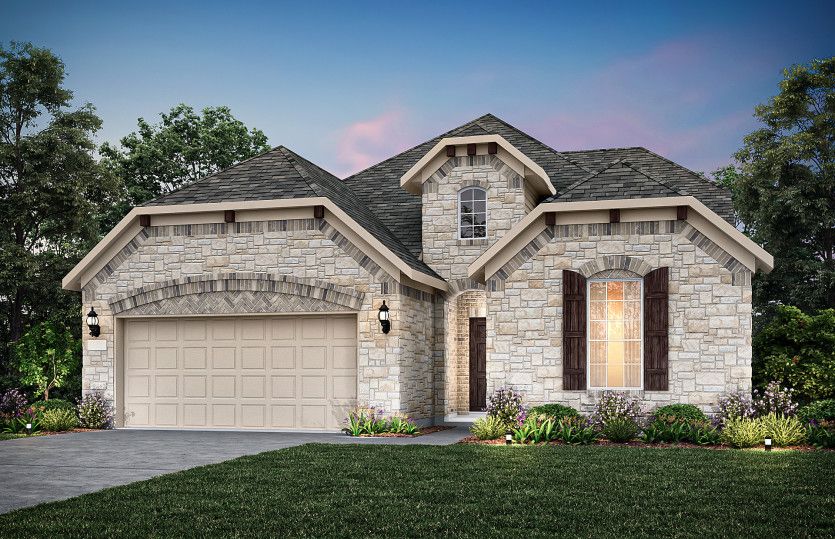 Exterior F with stone and a 2-car garage with storage space