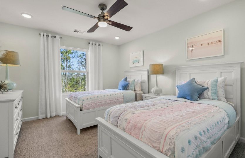 The secondary guest bedroom provides ample room for relaxation, ensuring a comfortable and rejuvenat