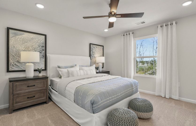Relax in this cozy guest room with decorative lighting.