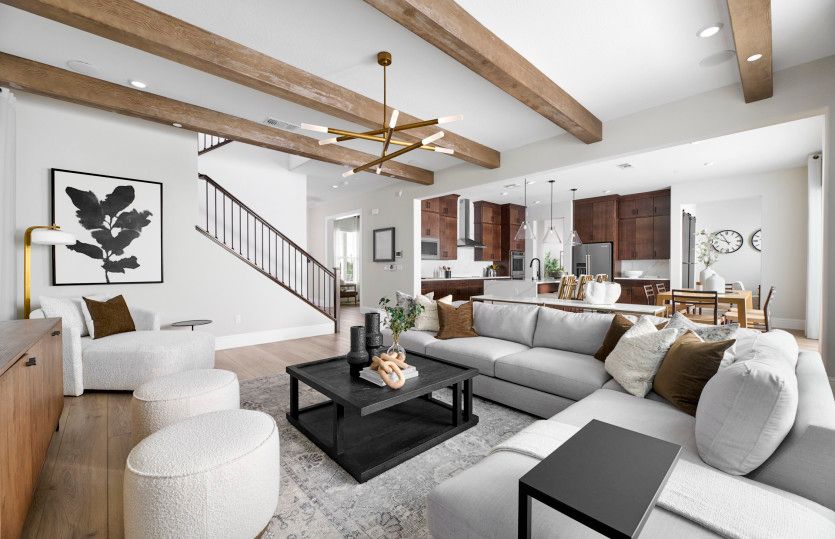 Open gathering area with view of kitchen