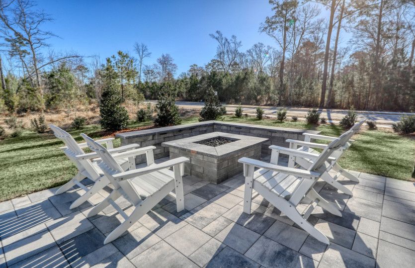 The outdoor patio beckons with welcoming allure, offering a serene escape.