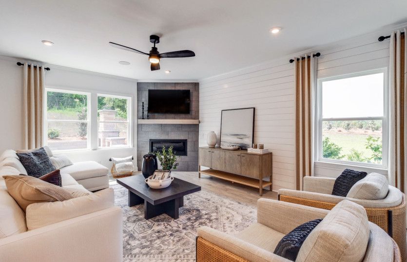 Gathering room with a fireplace to enhance your entertaining space.