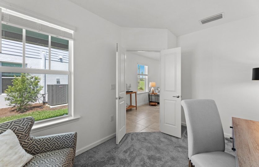 Den with french doors, perfect for a home office or overnight guests