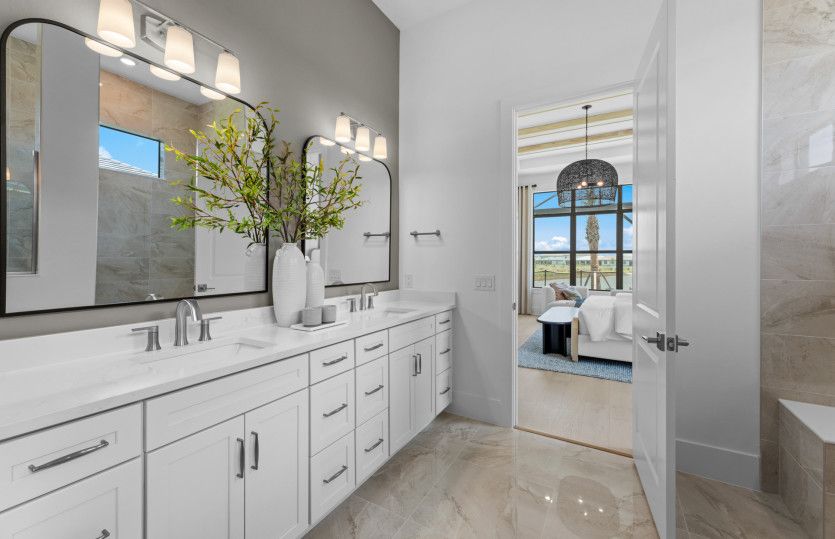Owner's bathroom with walk-in shower and dual sink vanity