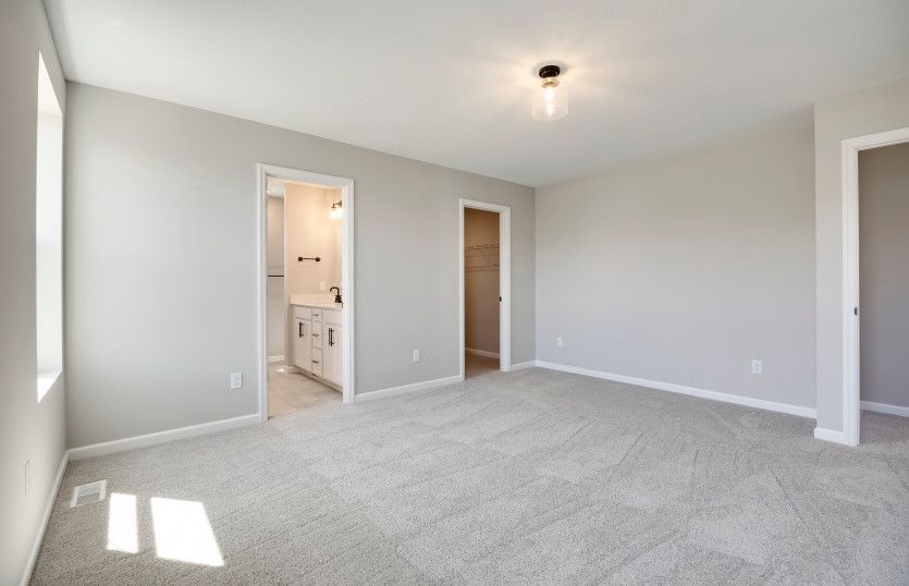 Owner's bedroom with a private owner's bath and walk-in closet