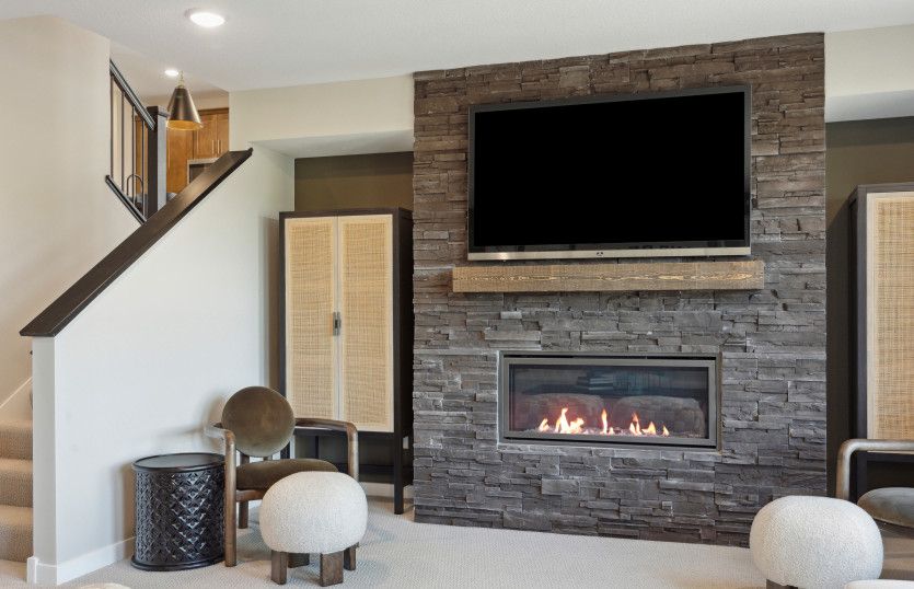 Lower Level Game Room Featuring a Gorgeous Fireplace
