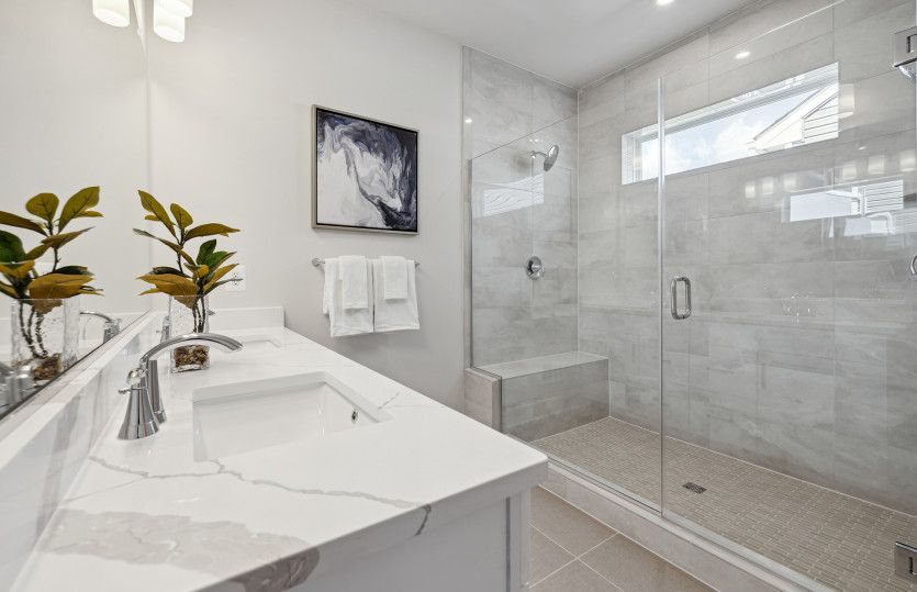 Owner's Bath with Dual Sinks and Frameless Shower