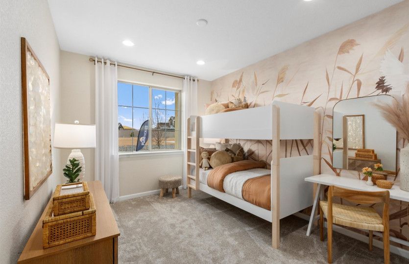 Secondary bedroom features a large window for plenty of natural light.