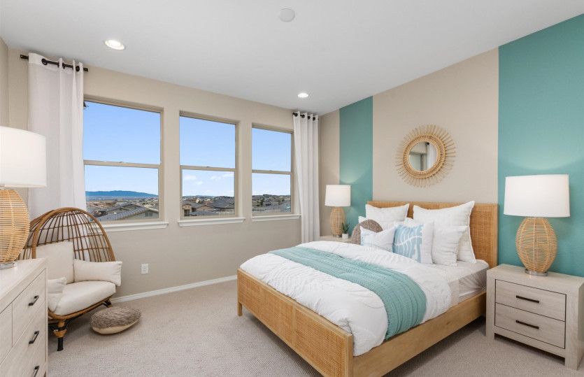 Third bedroom upstairs features cozy carpeting, two-tone paint detail and a walk-in closet.