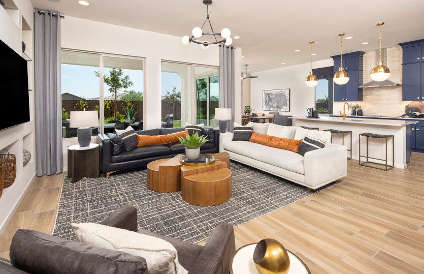 Gathering space in the Coventry II home design with bright windows and decorative details.