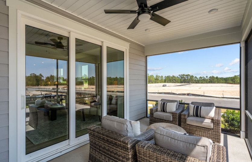 Breezy Screened in Patio with large retractable doors for extending entertaining.