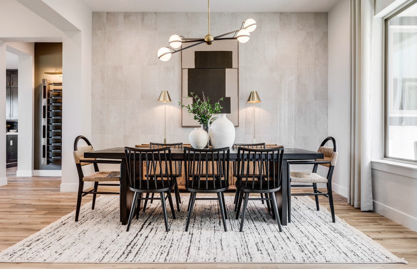 The formal dining area enhanced with an accent light fixture is the perfect place to enjoy meals wit