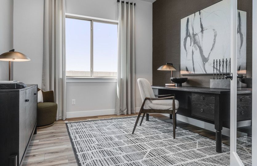 Den off the entryway can be used as a home office, craft room, and more.