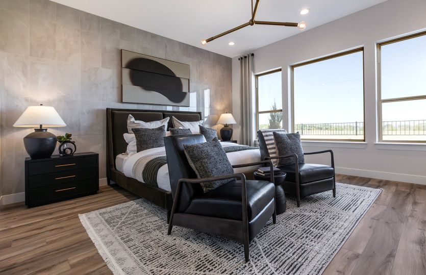 Luxurious owner's suite shown with an overhead accent lighting fixture and a beautiful, tile accente