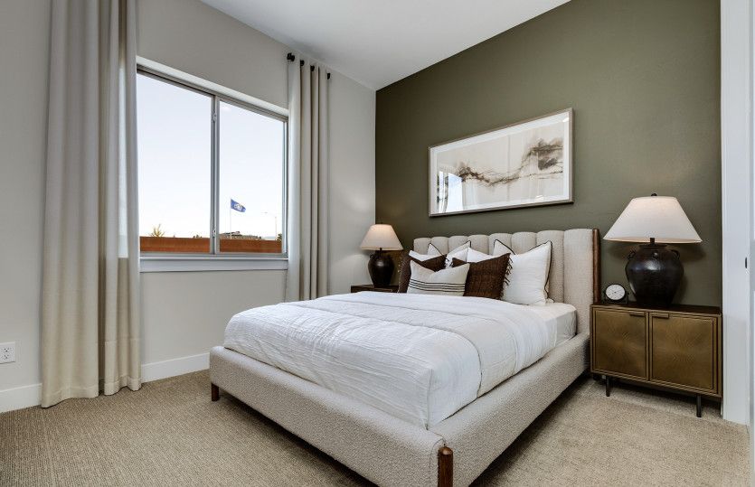 Bedroom 2 is simple, bright, and perfect for a children's room or guest room.