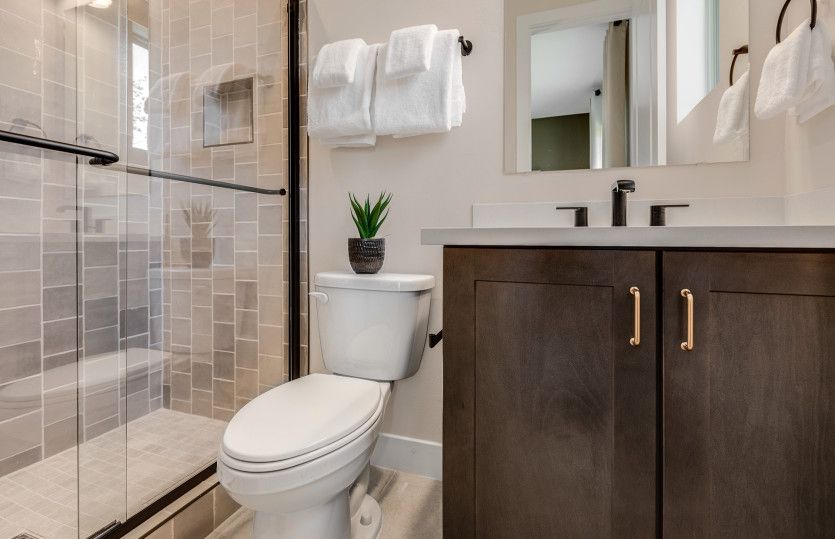 Walk-in shower in bath two with beautiful tile surrounds.