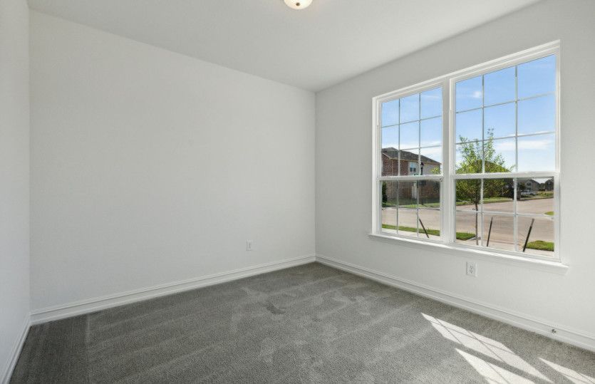 Spacious secondary bedroom with ample closet space *model representation