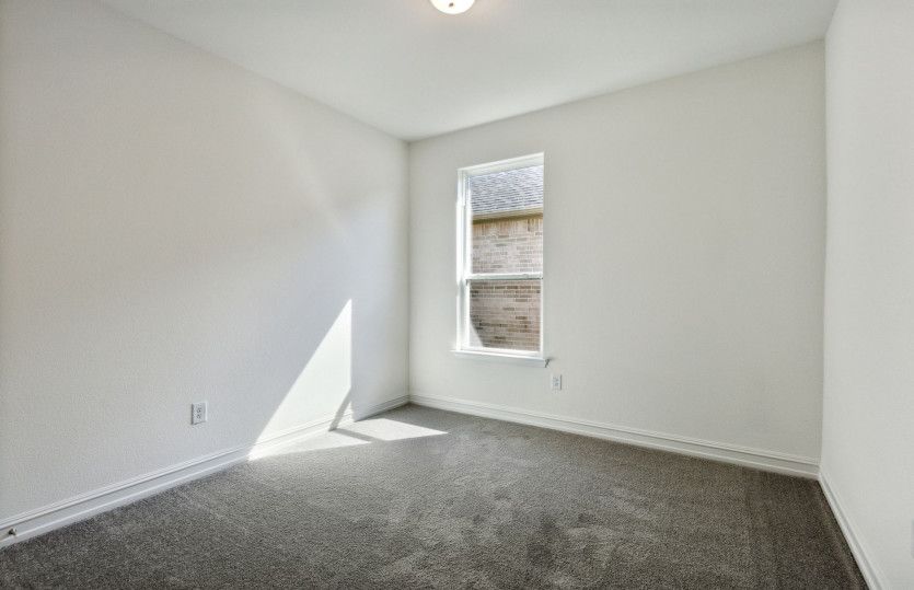 Spacious secondary bedroom with ample closet space *model representation