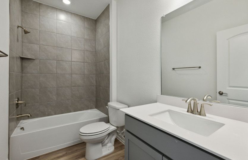 Spacious secondary bathroom with premium finishes *model representation