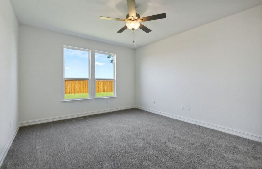 Spacious owner's suite with large windows and private bathroom
