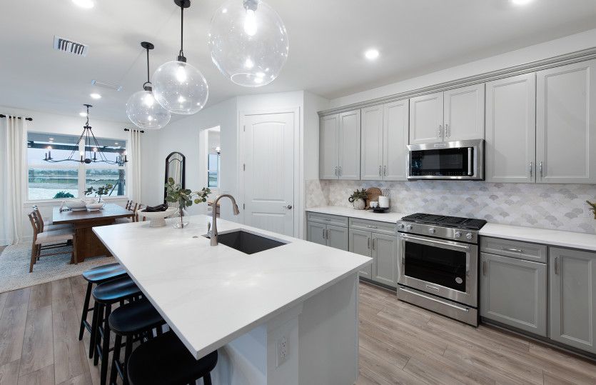 Gourmet kitchen with center island and stainless steel appliances