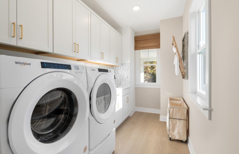 Super Laundry with a Utility Sink & Cabinetry for Extra Storage