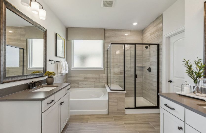 Owner's bath with separate vanities*model representation