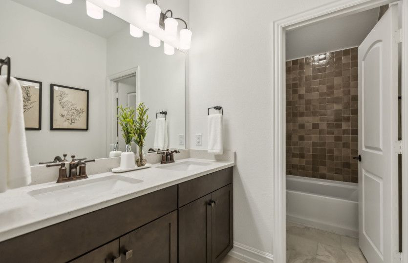Spacious secondary bathrooms*model representation