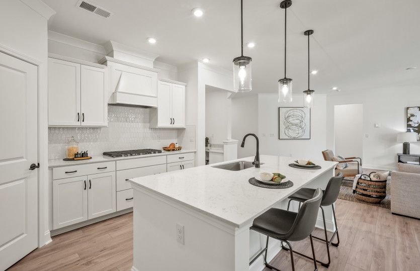 Bright Open Kitchen with Large Island and Café