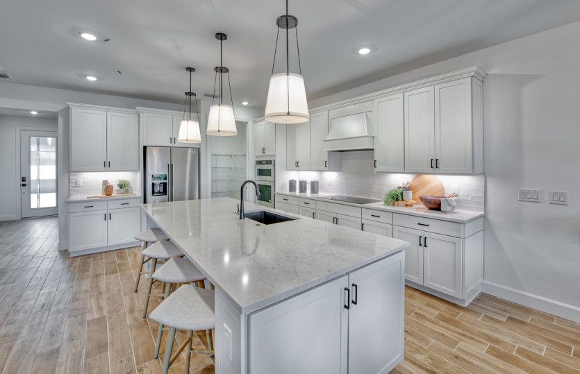 Kitchen with stainless steel appliances and large island