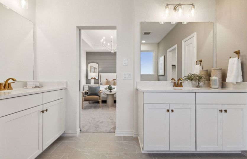 Owner's bath with separate vanities