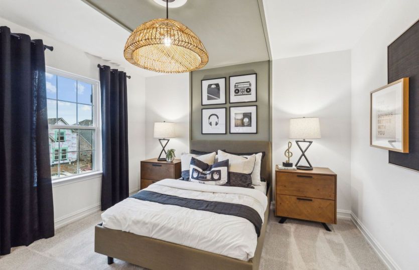 Spacious secondary bedroom *model representation