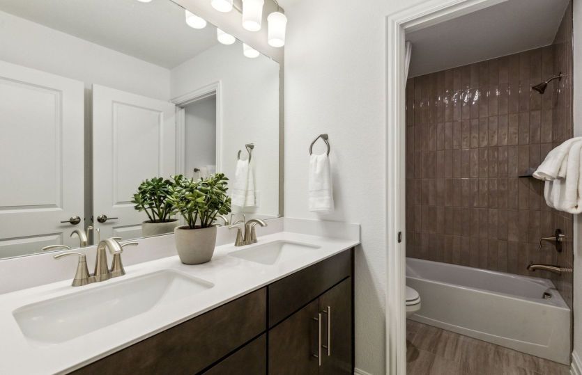 Spacious secondary bathroom *model representation