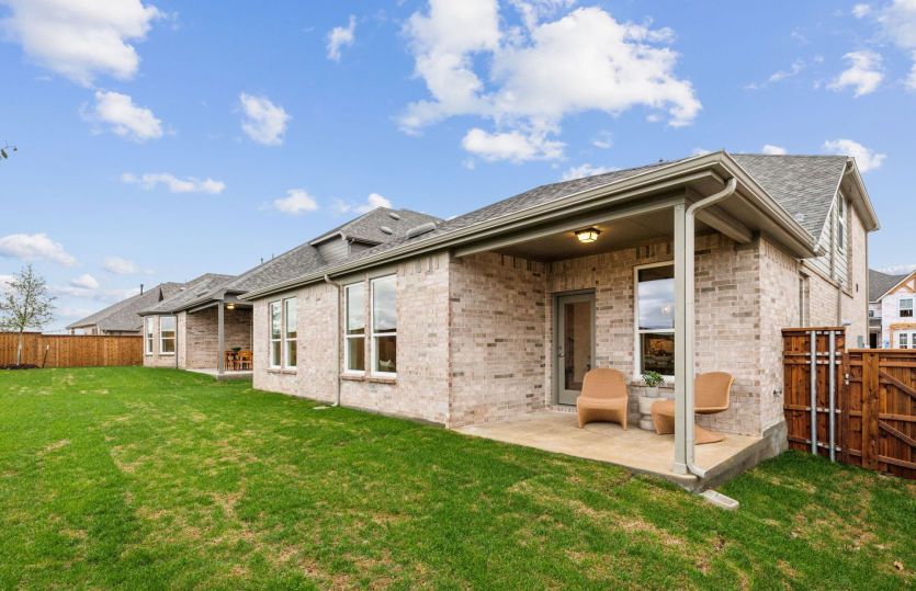 Spacious, covered back patio *model representation