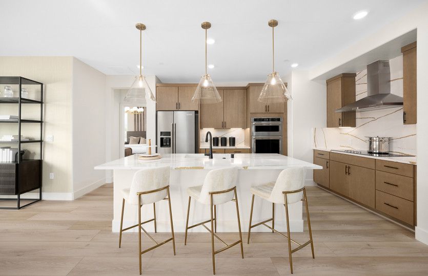 Open kitchen leading into inviting dining area