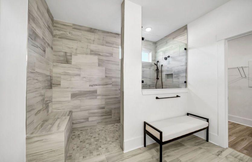 Ample room for movement and a built-in shower bench for added comfort and functionality.