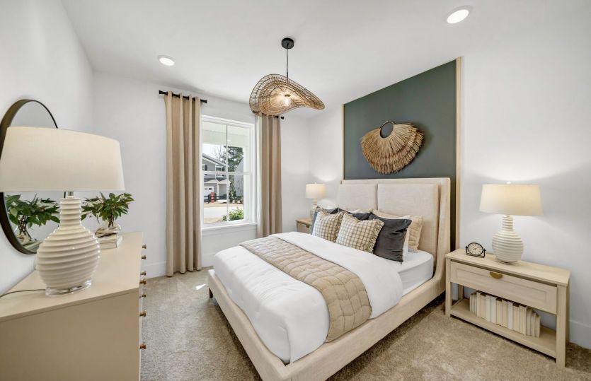 Cozy yet spacious, this secondary bedroom is designed with relaxation in mind."