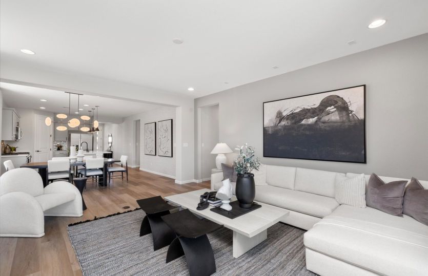 Gathering room open from the dining room and kitchen in the Hewitt home design.