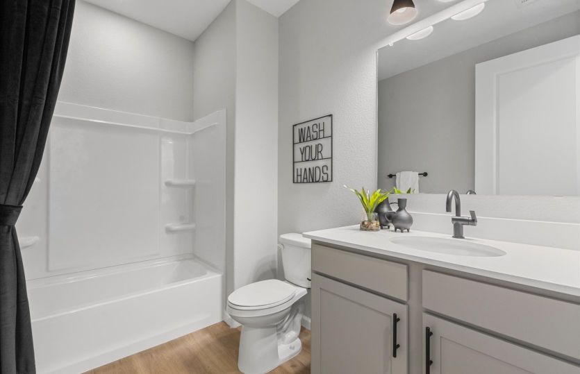 Bathroom 2 serves the secondary bedrooms and is complete with a shower/tub combo.