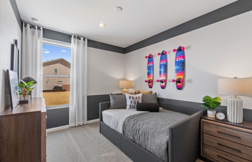 Spacious secondary bedroom with a bright open window and closet.