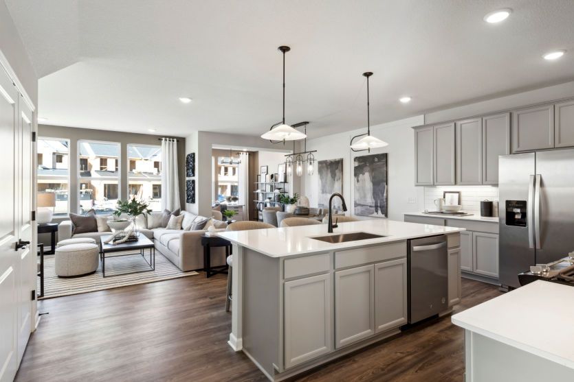 Standing in the Kitchen Looking into the Gathering Room, Sunroom, and Cafe
